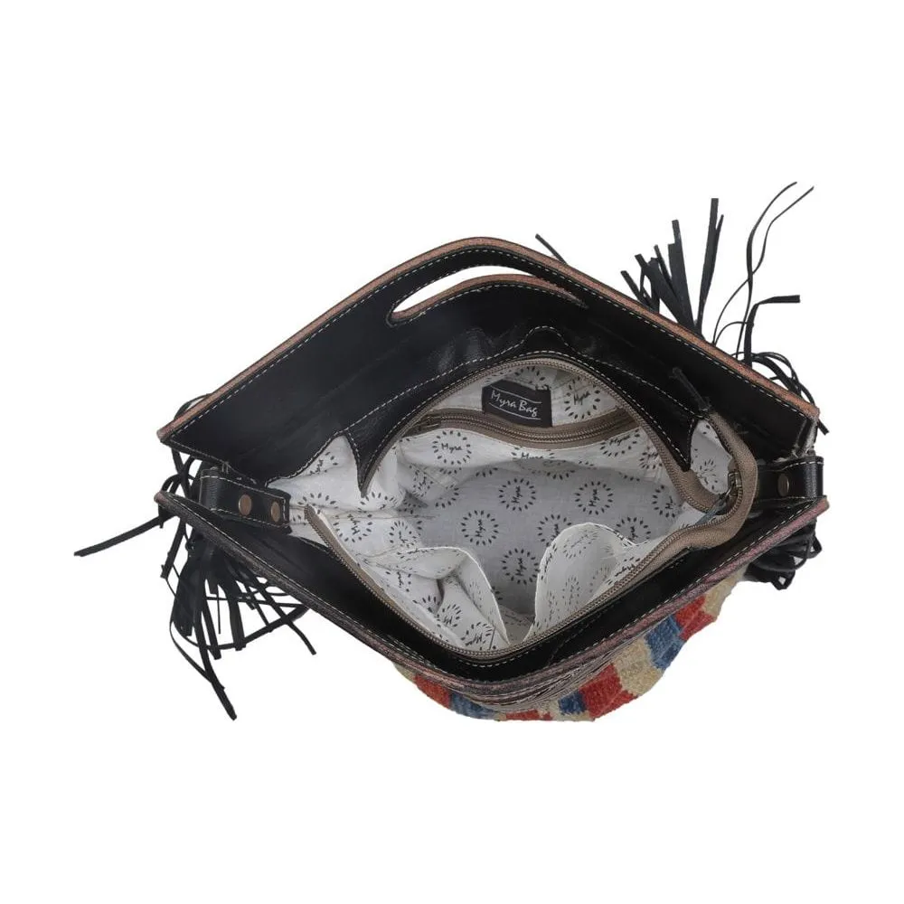 Impactful Hand-Tooled Bag